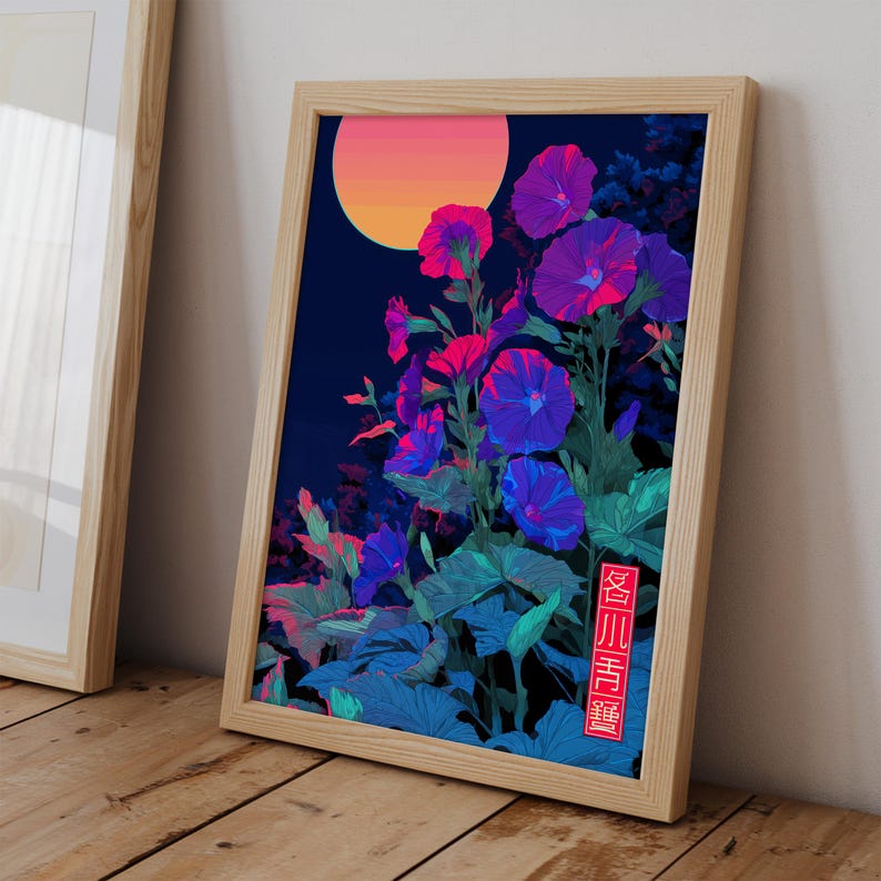 May include: A framed art print featuring a vibrant illustration of morning glory flowers in shades of purple, pink, and blue against a dark blue background. A gradient orange and pink sun is in the upper left corner. The artwork is in a light wood frame.