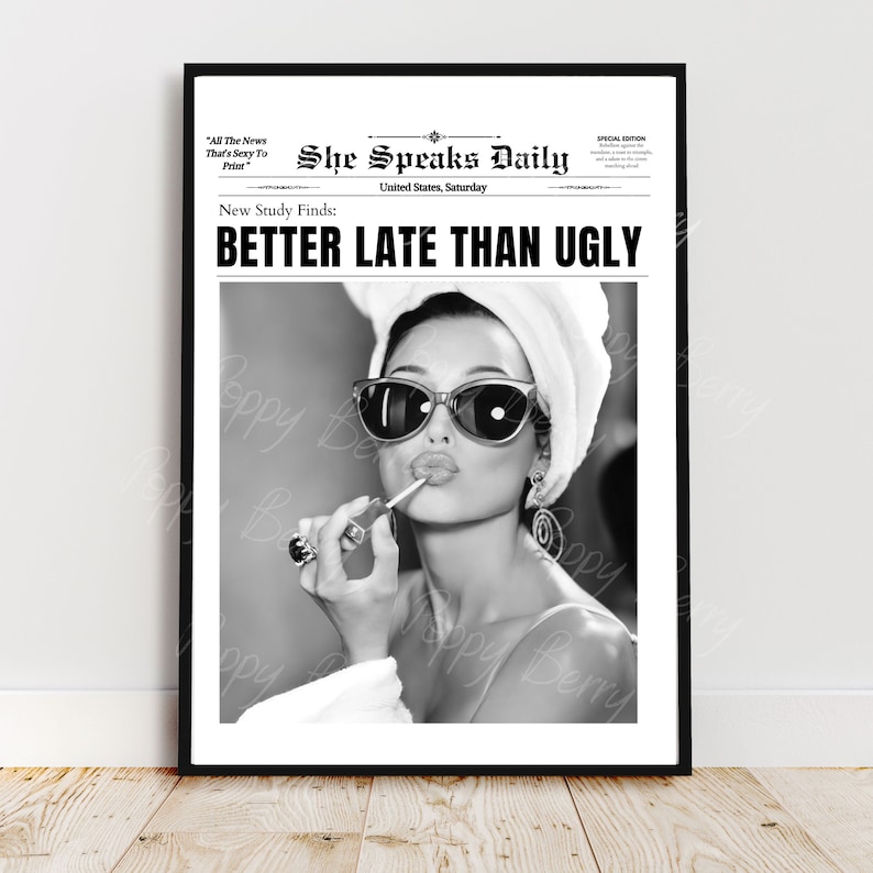 May include: Black and white photo of a woman wearing sunglasses and a white towel on her head. She is applying lipstick and the headline reads "She Speaks Daily" with the subheading "New Study Finds: BETTER LATE THAN UGLY".