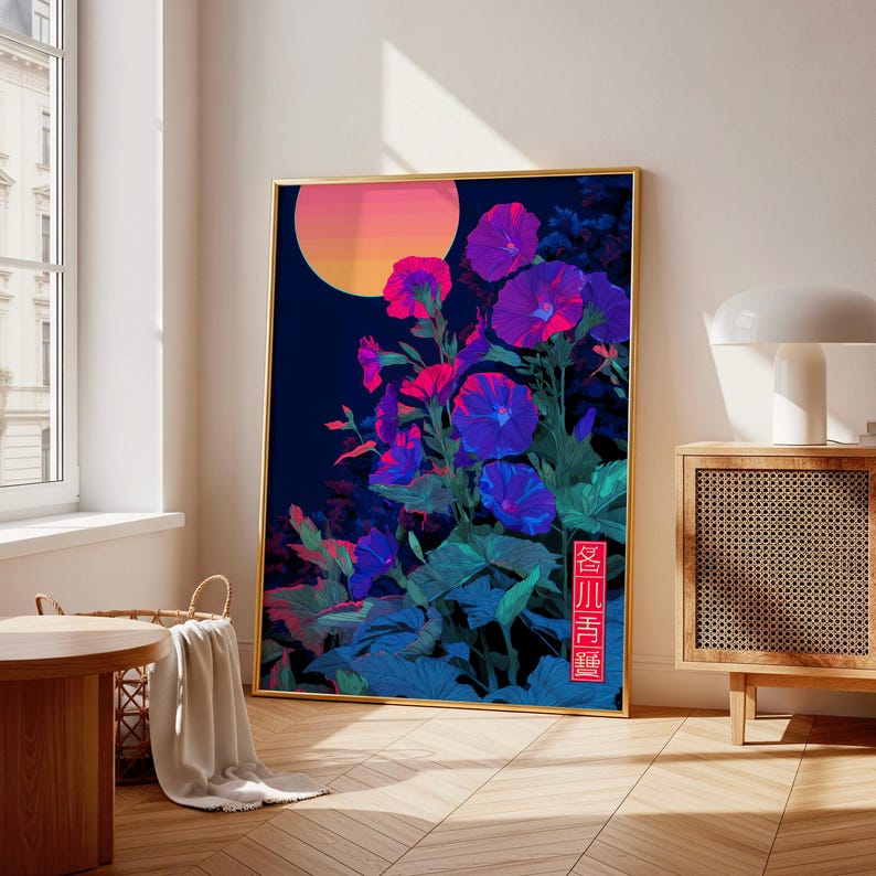 May include: A framed art print featuring vibrant purple and blue flowers with a gradient orange and pink sun against a dark blue background. The artwork has a gold frame and a Japanese text in the lower right corner.
