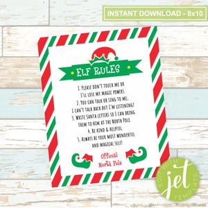 May include: A printable 8x10 inch Elf Rules sign with a red and green striped border. The sign features a cartoon elf with a red hat and a list of rules for interacting with the elf. The text on the sign reads: "Elf Rules: 1. Please don't touch me or I'll lose my magic powers. 2. You can talk or sing to me. I can't talk back but I'm listening! 3. Write Santa letters so I can bring them to him at the North Pole. 4. Be kind & helpful. 5. Always be your most wonderful and magical self! Official North Pole"