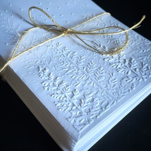 Simple classic but detailed hand made white embossed woods scene with snow 8 pack Christmas winter cards