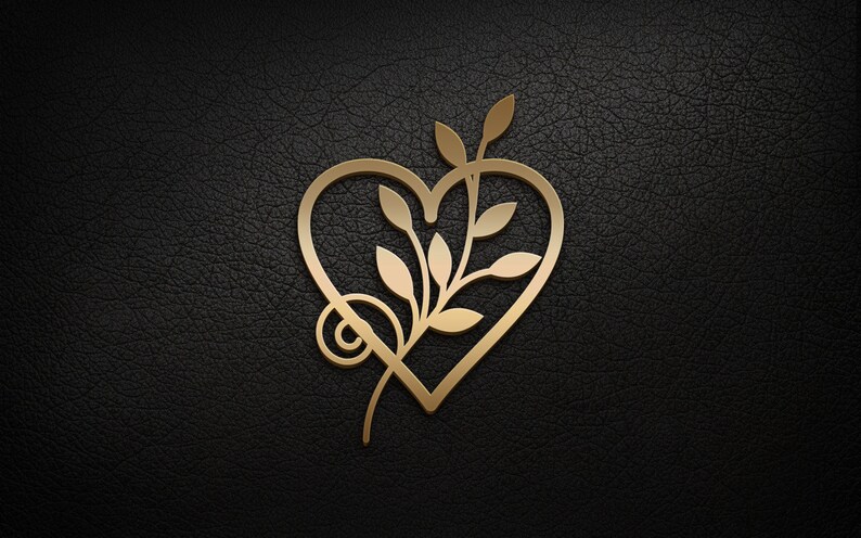 May include: A gold-colored heart-shaped design with a stylized branch and leaves inside. The design is on a black textured background.