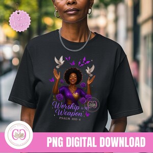 May include: Black t-shirt featuring a graphic of a woman with arms raised, surrounded by doves, butterflies, and roses. The text "Worship is My Weapon" and "Psalm 100:4" are also displayed. The shirt is a PNG digital download.