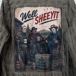 May include: An olive green button-down shirt featuring a large back graphic of three horror movie characters sitting on a porch. The text reads Well SHEEYIT, YEP, THAT'S RIGHT DARLIN, CAMP BLOOD, and BEST KILLERS AROUND. The shirt has a textured fabric.