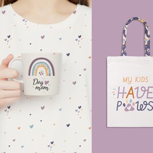 May include: A white mug with a rainbow design and the text "Dog mom." A white tote bag with the text "My kids have paws" and a paw print graphic. The tote bag has a patterned handle with dog illustrations.
