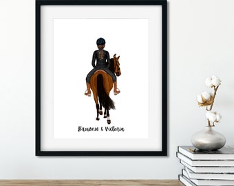 May include: A framed equestrian art print featuring a rider on a brown horse, viewed from the rear. The rider wears a black riding outfit and helmet. The print is in a black frame, with the text "Brownie & Victoria" at the bottom.