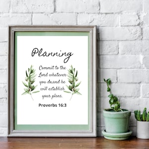 May include: A printable wall art design with a white background and green olive branches. The text reads "Planning Commit to the Lord whatever you do, and he will establish your plans. Proverbs 16:3"