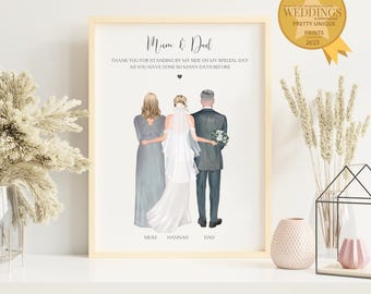 May include: A framed print featuring a bride with her parents. The text reads "Mum & Dad" and a thank you message. The illustration shows the bride in a white dress and veil, with her parents on either side. The frame is light wood.
