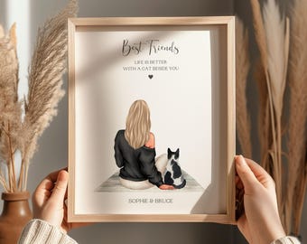 May include: A framed print with the words "Best Friends" and "Life is better with a cat beside you." The illustration shows a person with long blonde hair and a black sweater sitting with a black and white cat. The names "Sophie & Bruce" are at the bottom.
