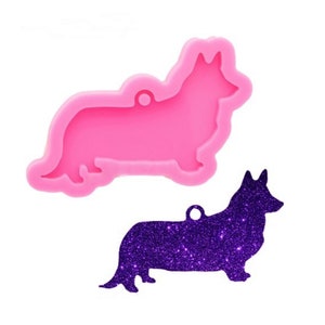 May include: Pink silicone mold of a Corgi dog with a hole for a charm. A purple glitter Corgi charm is shown next to the mold.