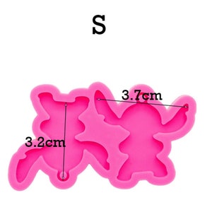May include: Pink silicone mold for making two small Stitch figures. The mold measures 3.7 inches by 3.2 inches.