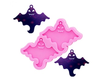 Puede incluir: Moldes rosas de silicona con forma de fantasma y dos colgantes morados oscuros con forma de fantasma. Los moldes tienen un diseño detallado de cara de fantasma. Los colgantes tienen un diseño similar con un pequeño agujero para colgar. Perfecto para manualidades de Halloween.
