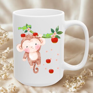 May include: White ceramic mug with a cartoon monkey design, red apples, and the text "Finally this year is almost over!". The mug has a large handle and floral decorations. The design is printed on a white mug.