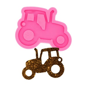 May include: Pink silicone mould of a tractor with a gold glitter tractor silhouette.