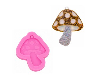 May include: Pink silicone mold shaped like a mushroom with white dots. The mold is used to create resin crafts.