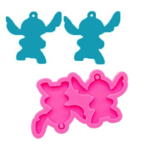 May include: Pink silicone mold with two Stitch character shapes. The mold is designed to create two Stitch charms.