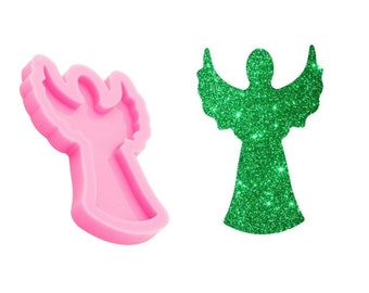 May include: Pink silicone mold shaped like an angel with outstretched wings. The mold is designed for creating resin crafts.
