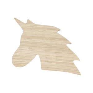 May include: Wooden cutout of a unicorn head, with a light brown wood grain finish.