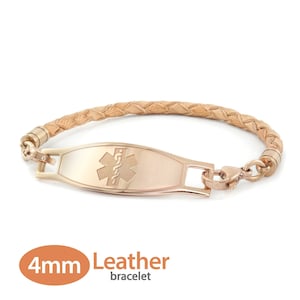 Peut inclure: Un bracelet en cuir tressé de 4 mm de large avec une plaque d'identification médicale en or rose ornée du symbole de l'étoile de la vie. La plaque est gravée d'un symbole d'alerte médicale.