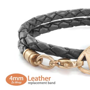 May include: Black braided leather bracelet with gold-coloured clasp and accents. The bracelet is a 2x wrap design and is 4mm wide. The text on the image says "4mm Leather replacement band".