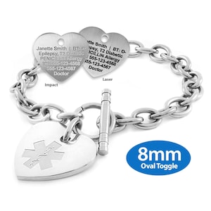 May include: A silver medical alert bracelet with a chain link design. The bracelet features three heart-shaped charms. Two charms have engraved text, and one has a medical symbol. The bracelet has an 8mm oval toggle clasp.