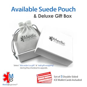 May include: A white suede pouch with the Medicengraved logo, inside a white gift box with the Medicengraved logo. The box is open and the pouch is visible. The image also includes three red emergency wallet cards with the text "Emergency Wallet Card" and a set of 3 double-sided ICE wallet cards included.
