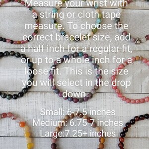May include: Image showing a sizing guide for bracelets. Text advises measuring the wrist and adding a half inch for a regular fit or a whole inch for a loose fit. Small: 6-7.5 inches, Medium: 6.75-7 inches, Large: 7.25+ inches.