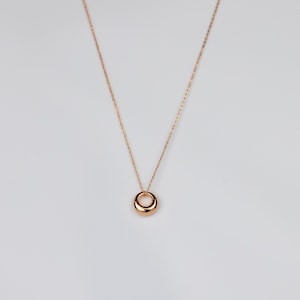 OLIVIA, dainty abstract circle pendant in rose gold