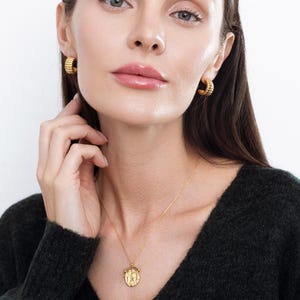 Model wears, "Harper," Gold Roman Coin Necklace: Vintage Medallion Arc Pendant, 925 Sterling Silver and "Esmee," chunky ribbed earrings