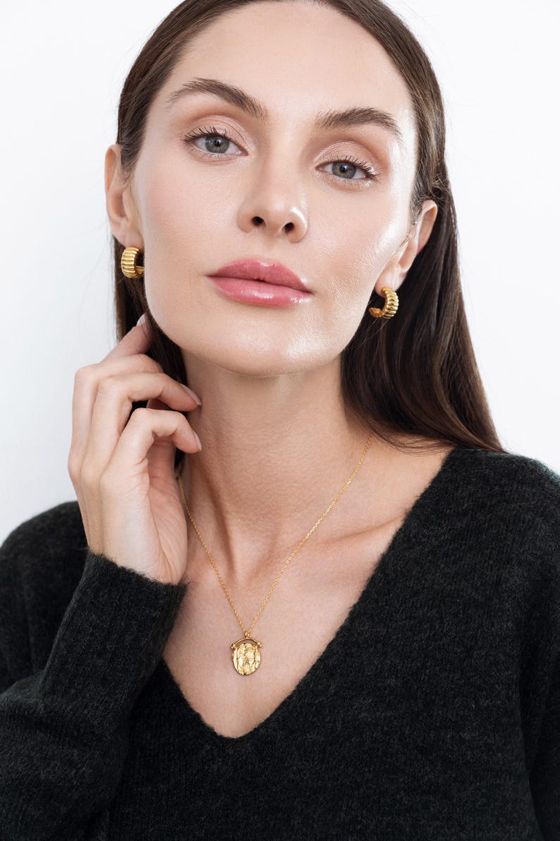 Model wears, "Harper," Gold Roman Coin Necklace: Vintage Medallion Arc Pendant, 925 Sterling Silver and "Esmee," chunky ribbed earrings