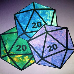 May include: Three colorful, twenty-sided dice with a marbled effect. Each die is a different color: blue, green, and purple. The number 20 is printed in black on each die. Black lines define the edges of the dice.