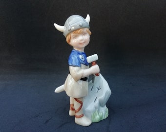 Royal Copenhagen Figurine, Faun Playing Flute with a Lizard 433 sold at auction on 24th March