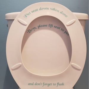 May include: White toilet seat with a green decal that reads "Put seat down when done. Boys, please lift seat to pee. And don't forget to flush."