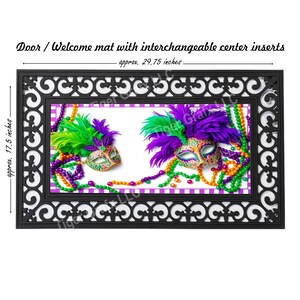 May include: A black doormat with a decorative border and a center insert featuring two Mardi Gras masks with purple, green, and gold feathers and beads. The doormat measures approximately 29.75 inches by 17.5 inches.