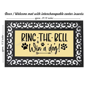 May include: A black doormat with a decorative border and a yellow center panel. The text "RING THE BELL Win a dog!" is printed in black on the yellow panel. The doormat measures approximately 29.75 inches by 17.5 inches.