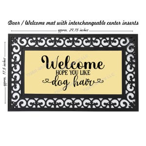 May include: A black doormat with a white decorative border and a yellow center panel. The text "Welcome Hope You Like Dog Hair" is printed in black on the yellow panel.