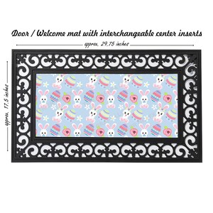 May include: Black doormat with a white border and a removable center insert featuring a repeating pattern of pastel pink and blue Easter eggs and bunnies on a light blue background. The doormat measures approximately 29.75 inches by 17.5 inches.
