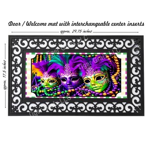 May include: A black doormat with an intricate design featuring a decorative border. The center of the mat features a colorful image of three Mardi Gras masks with purple, green, and gold beads.