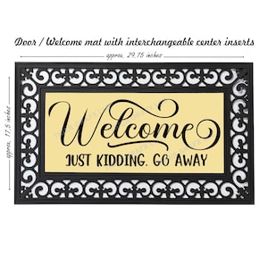 May include: A black doormat with a white decorative border and a yellow center panel. The text "Welcome" is written in a decorative script font, followed by the text "Just Kidding. Go Away" in a black sans-serif font.