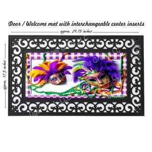 May include: A black doormat with a decorative border and a center insert featuring two purple, gold, and green Mardi Gras masks with beads. The doormat measures approximately 29.75 inches by 17.5 inches.
