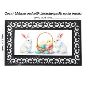May include: Black rectangular door mat with a decorative border and a watercolor Easter scene. The mat is approx. 29.75 inches long and 17.5 inches wide. The center insert features two white bunnies, a basket of eggs, and two chicks.