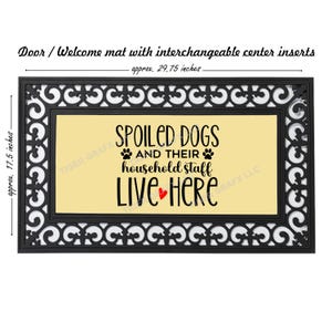May include: Black doormat with a white decorative border and a yellow center panel. The text "Spoiled Dogs and Their Household Staff Live Here" is printed in black with a red heart. The doormat measures approximately 29.75 inches by 17.5 inches.
