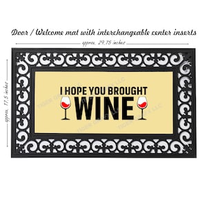 May include: A black doormat with a beige center insert that reads "I hope you brought wine" with two red wine glasses. The doormat measures approximately 29.75 inches by 17.5 inches.