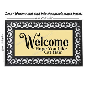 May include: Black and white welcome mat with a yellow center panel. The mat has a decorative border and the text "Welcome Hope You Like Cat Hair". The mat measures approximately 29.75 inches by 17.5 inches.