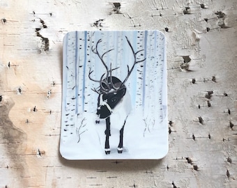 May include: A white reindeer with black antlers and hooves stands in a snowy forest. The background is a watercolor painting of blue and white trees.