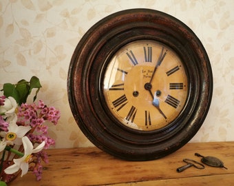 Wall clock with pendulum, antique, chiming, with roman numbers