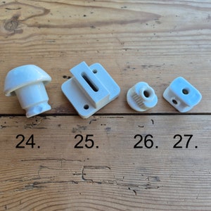 Ceramic insulator with rusty metal thread, vintage porcelain electrical installation