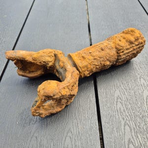 Old hand mechanism, rusted metal parts, industrial equipment