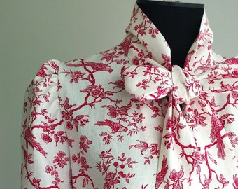 Red toile de Jouy printed cotton blouse with pussy-bow collar and bow
