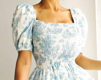 Blouse with smocks in toile de Jouy in turquoise blue cotton